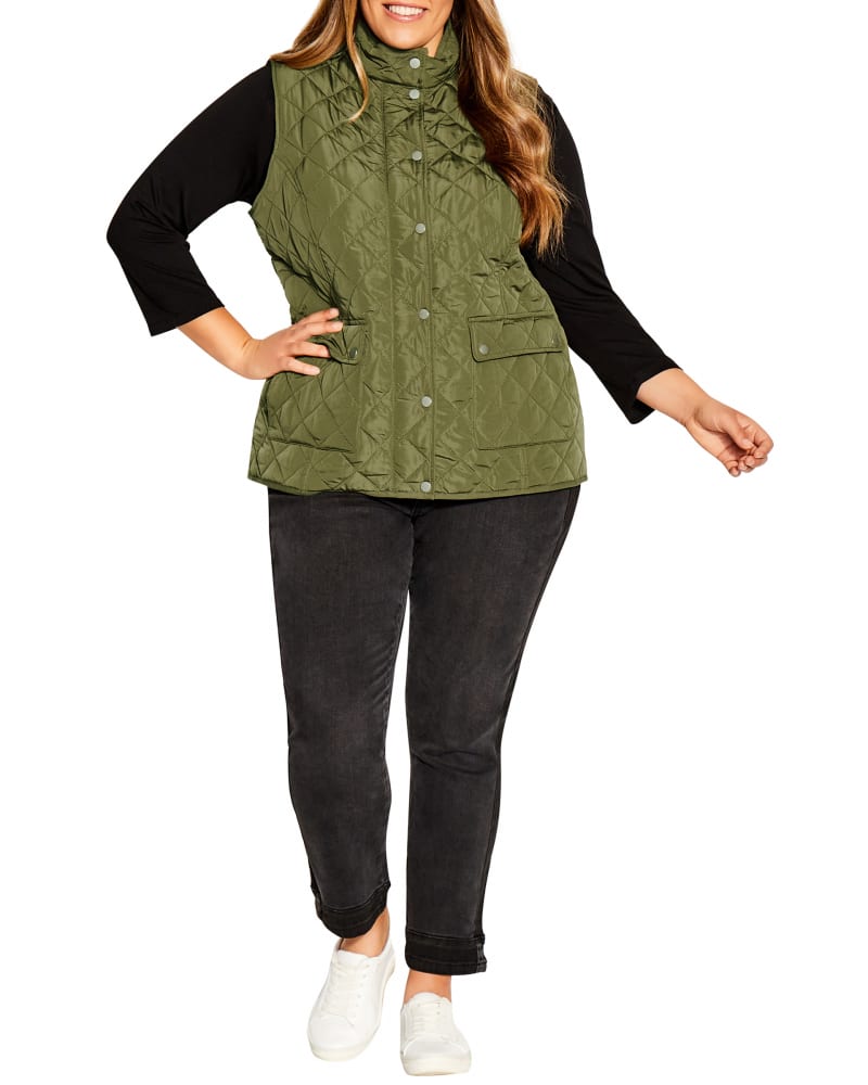 Front of a model wearing a size 14 Quinn Quilted Vest in Olive Green by avenue. | dia_product_style_image_id:234436